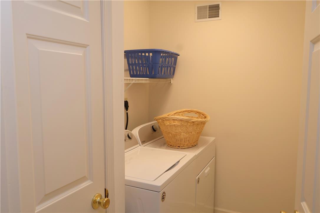 1282 Old Gate Road Northampton, PA 18067 - Photo 16 of 18 A well-organized utility room features a washer and dryer for household convenience.