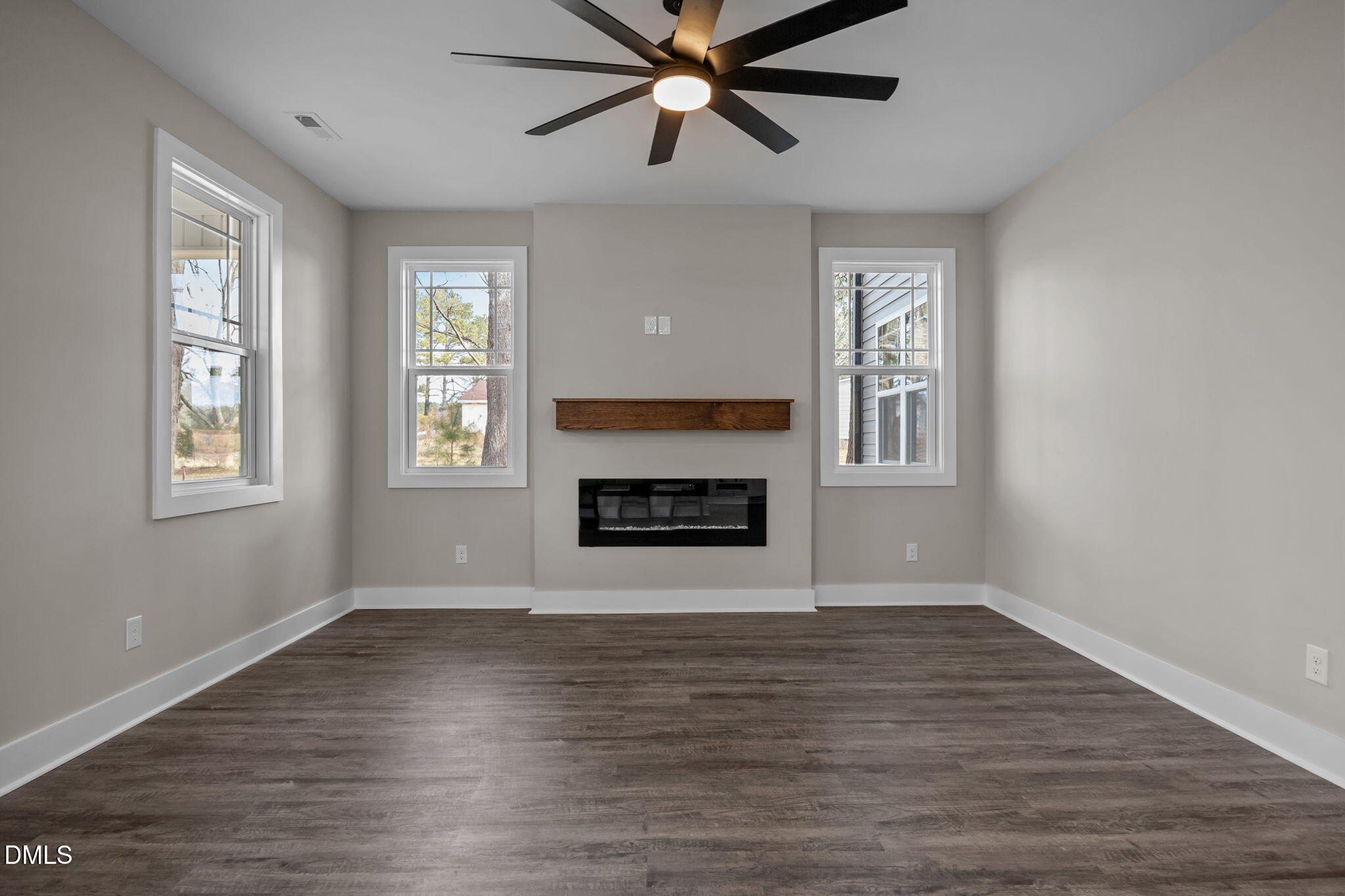 3917 Highway 42 Raleigh, NC 27603 - Photo 14 of 46 a view of an empty room with a window and fireplace