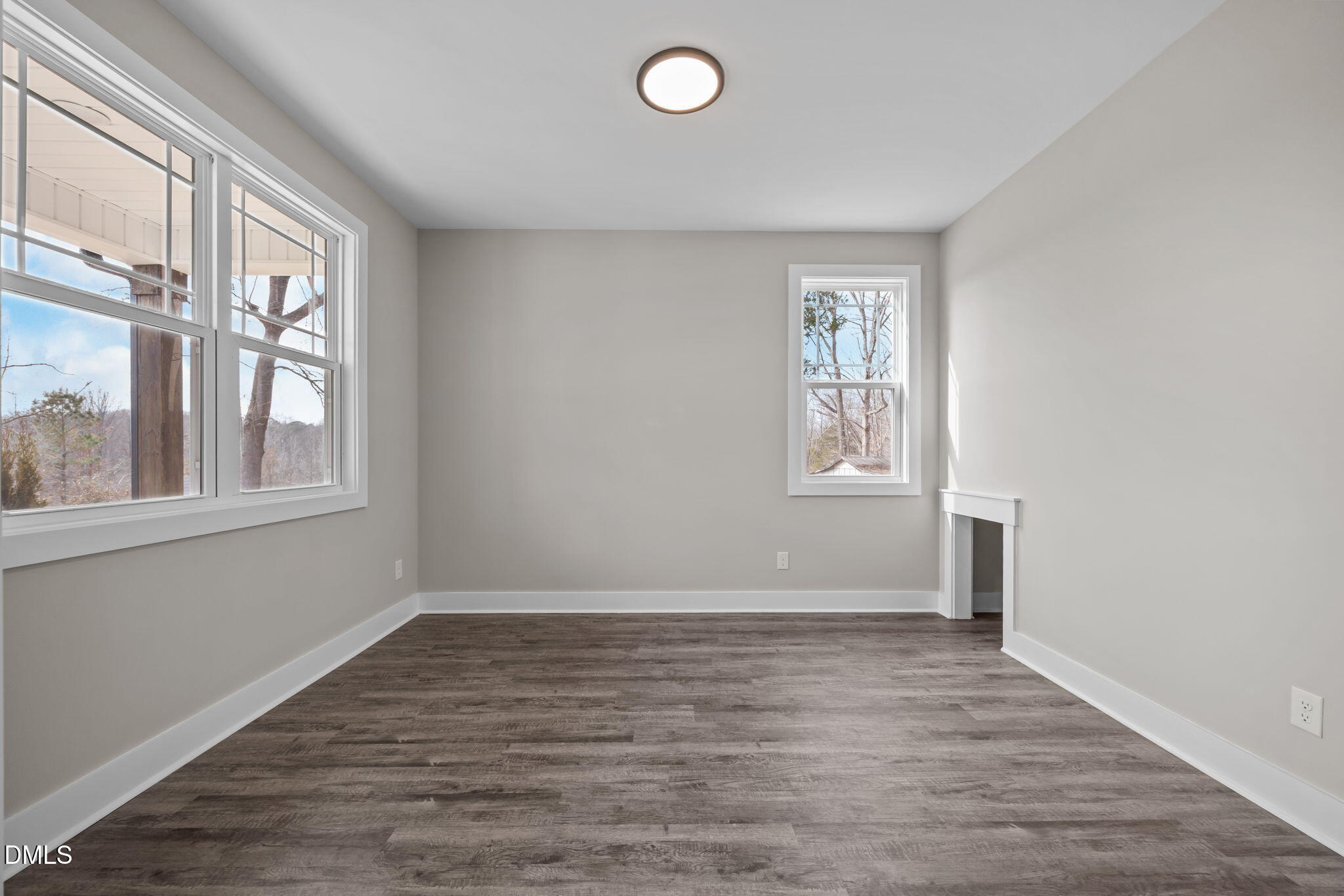 3917 Highway 42 Raleigh, NC 27603 - Photo 16 of 46 a view of an empty room with wooden floor and a window