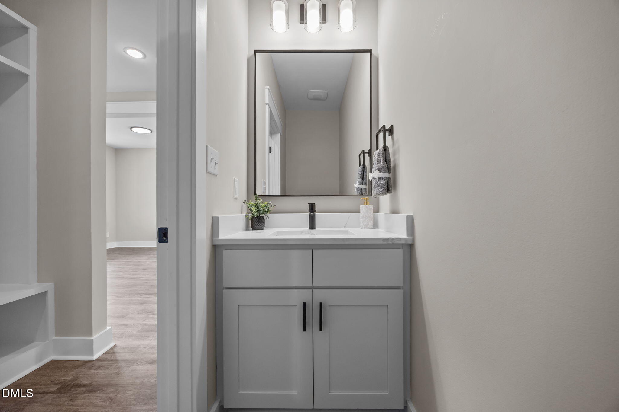 3917 Highway 42 Raleigh, NC 27603 - Photo 21 of 46 a bathroom with a sink and a mirror