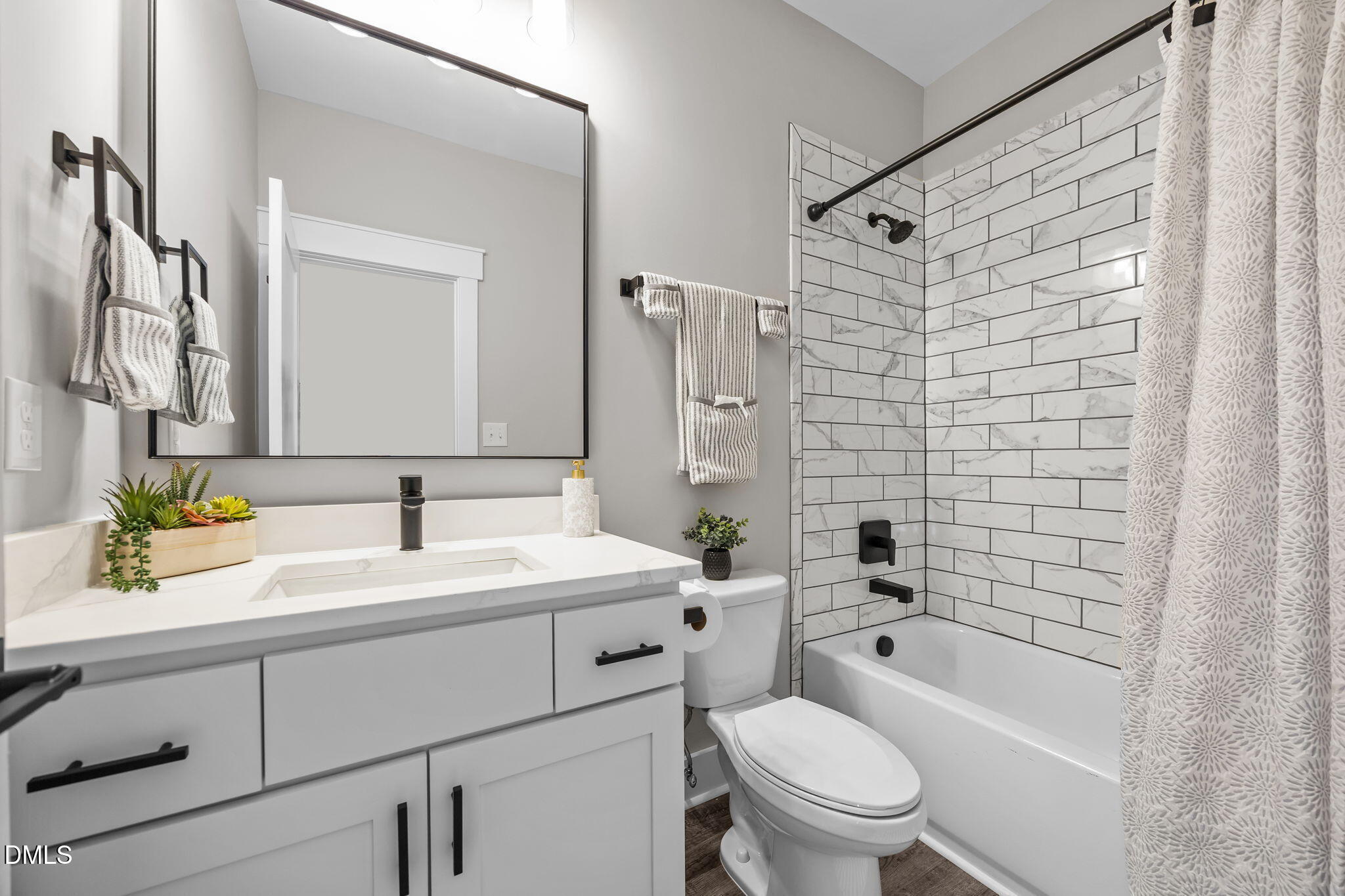 3917 Highway 42 Raleigh, NC 27603 - Photo 25 of 46 a bathroom with a sink toilet vanity and shower