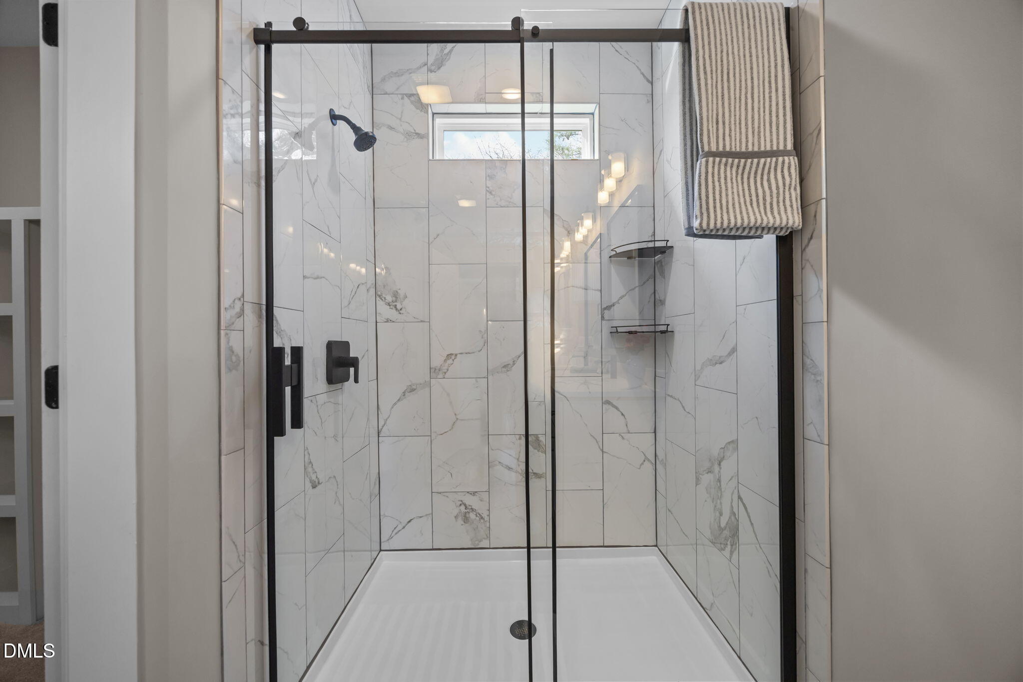 3917 Highway 42 Raleigh, NC 27603 - Photo 32 of 46 a bathroom with a glass shower door