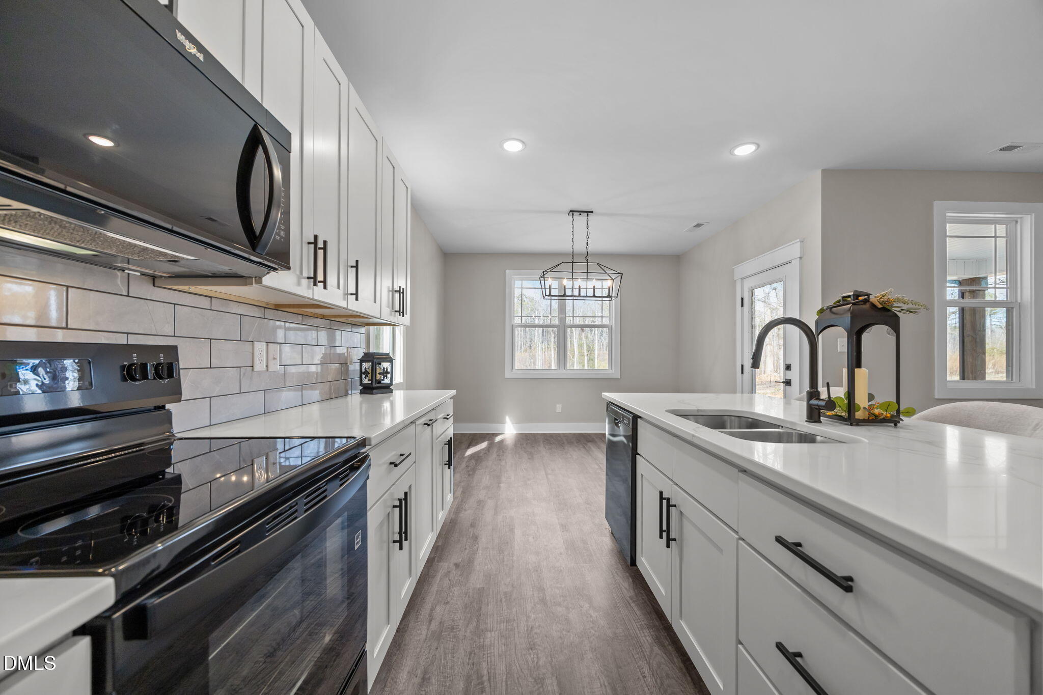 3917 Highway 42 Raleigh, NC 27603 - Photo 6 of 46 a kitchen with stainless steel appliances granite countertop a sink and stove