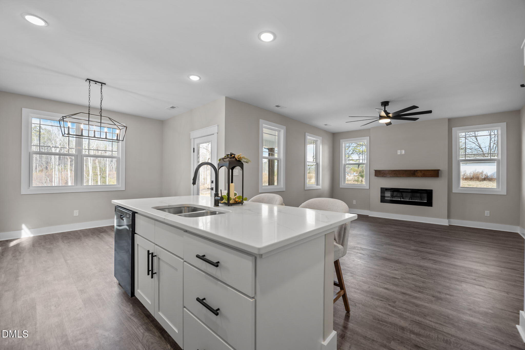 3917 Highway 42 Raleigh, NC 27603 - Photo 7 of 46 a kitchen with a stove and a wooden floor