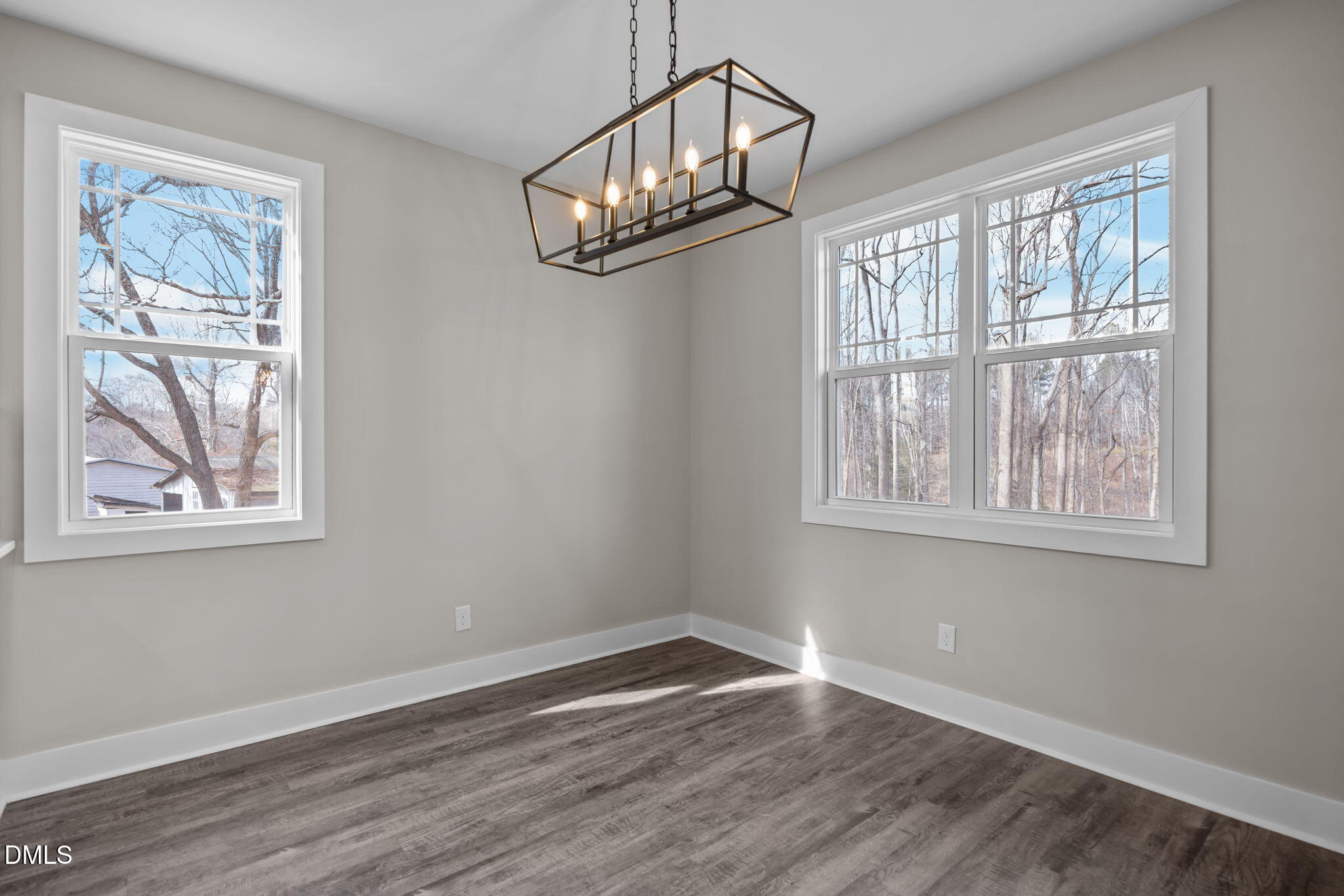 3917 Highway 42 Raleigh, NC 27603 - Photo 8 of 46 a view of an empty room with wooden floor and a window