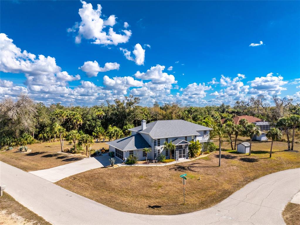 a view of a swimming pool with outdoor seating