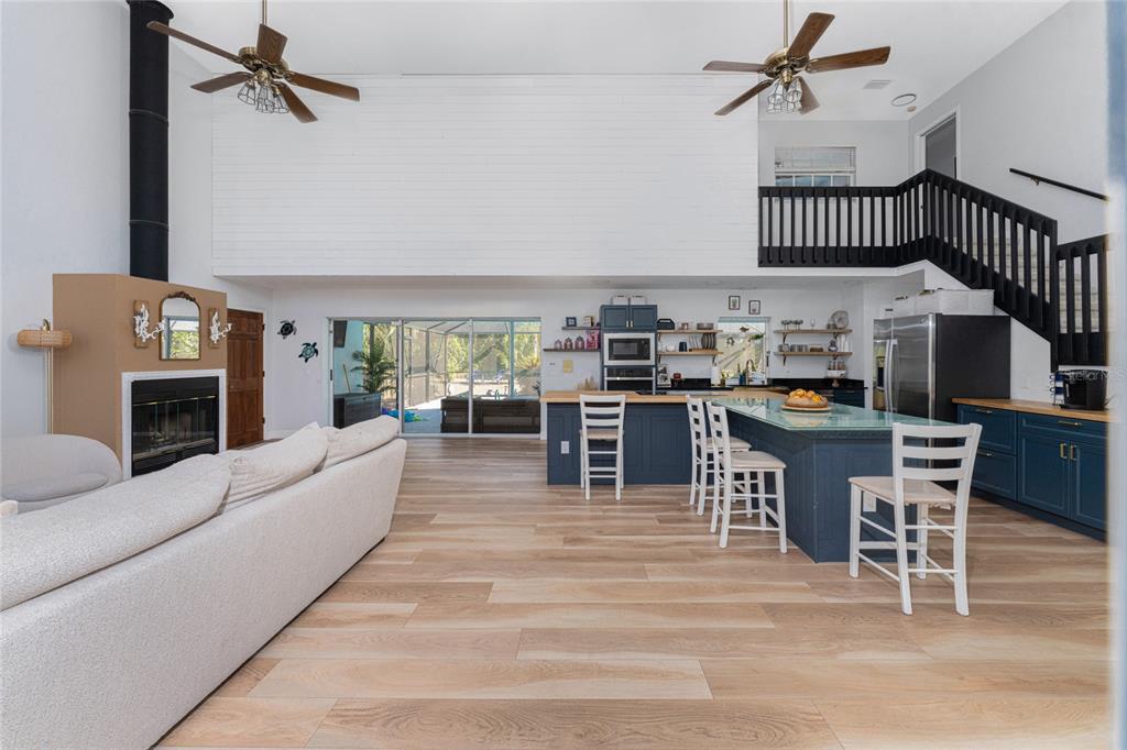 196 Lecturn Street Port Charlotte, FL 33954 - Photo 12 of 72 a living room with furniture a fireplace and a table