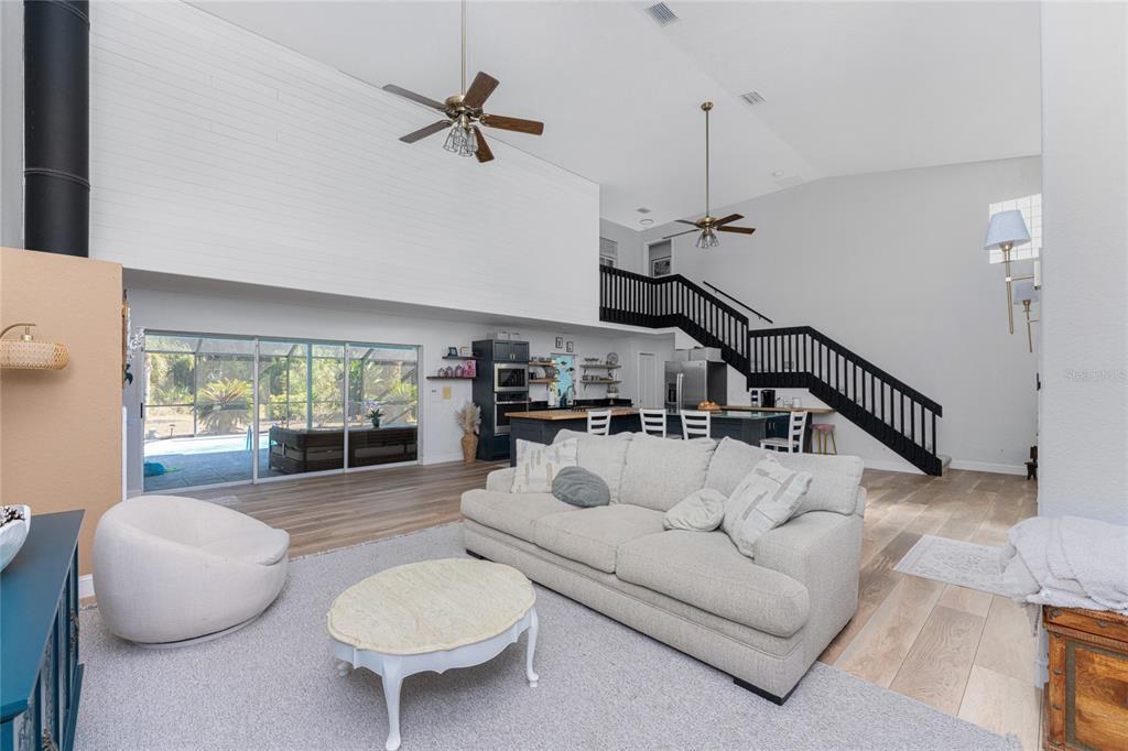 196 Lecturn Street Port Charlotte, FL 33954 - Photo 13 of 72 a living room with furniture and a wooden floor