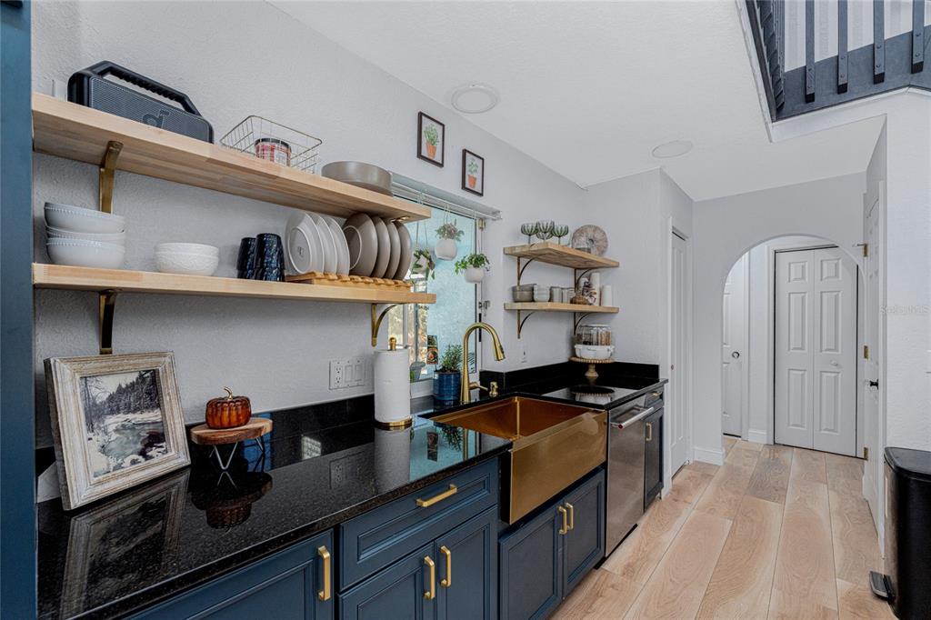 196 Lecturn Street Port Charlotte, FL 33954 - Photo 18 of 72 a kitchen with stainless steel appliances granite countertop a lot of cabinets