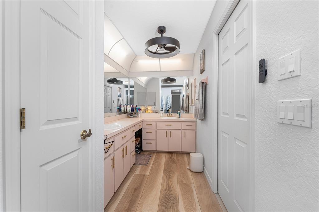 196 Lecturn Street Port Charlotte, FL 33954 - Photo 32 of 72 a bathroom with a sink a mirror and a shower