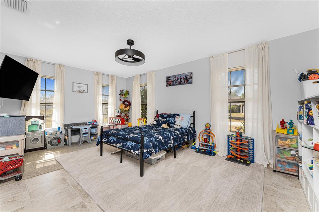 196 Lecturn Street Port Charlotte, FL 33954 - Photo 33 of 72 a living room with furniture and a flat screen tv