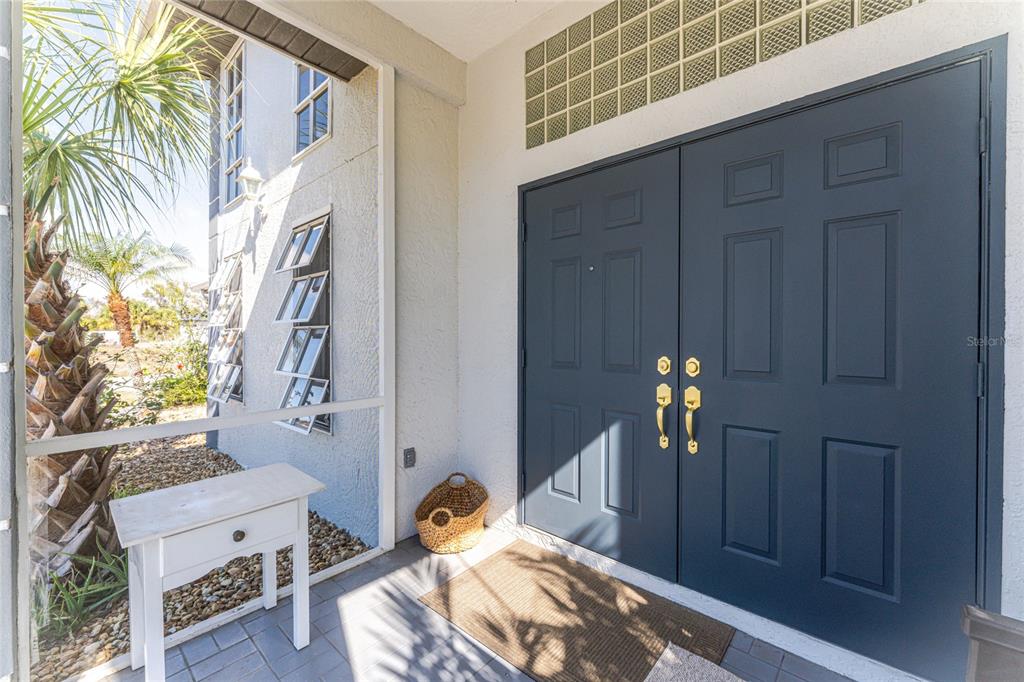 196 Lecturn Street Port Charlotte, FL 33954 - Photo 4 of 72 a bedroom with a bed and a chandelier
