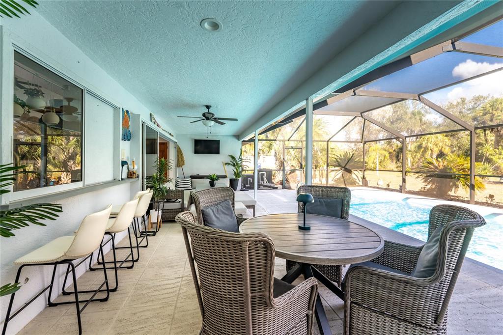 196 Lecturn Street Port Charlotte, FL 33954 - Photo 43 of 72 a view of a dining room with furniture window and outside view