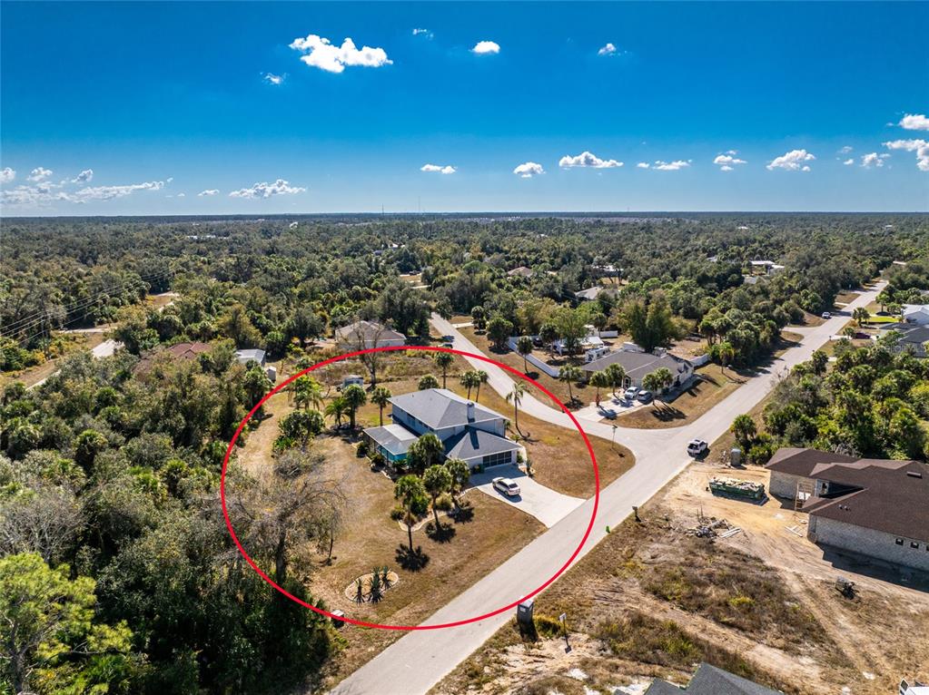 196 Lecturn Street Port Charlotte, FL 33954 - Photo 64 of 72 an aerial view of residential houses with outdoor space