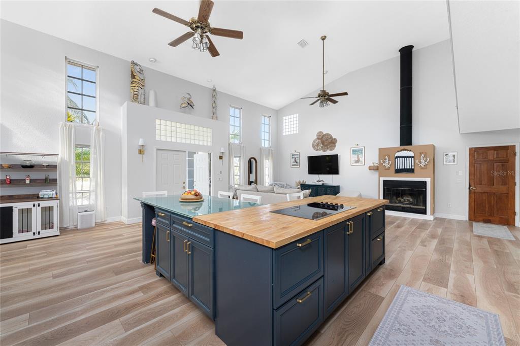 196 Lecturn Street Port Charlotte, FL 33954 - Photo 7 of 72 a kitchen with stainless steel appliances granite countertop a sink stove and wooden floor