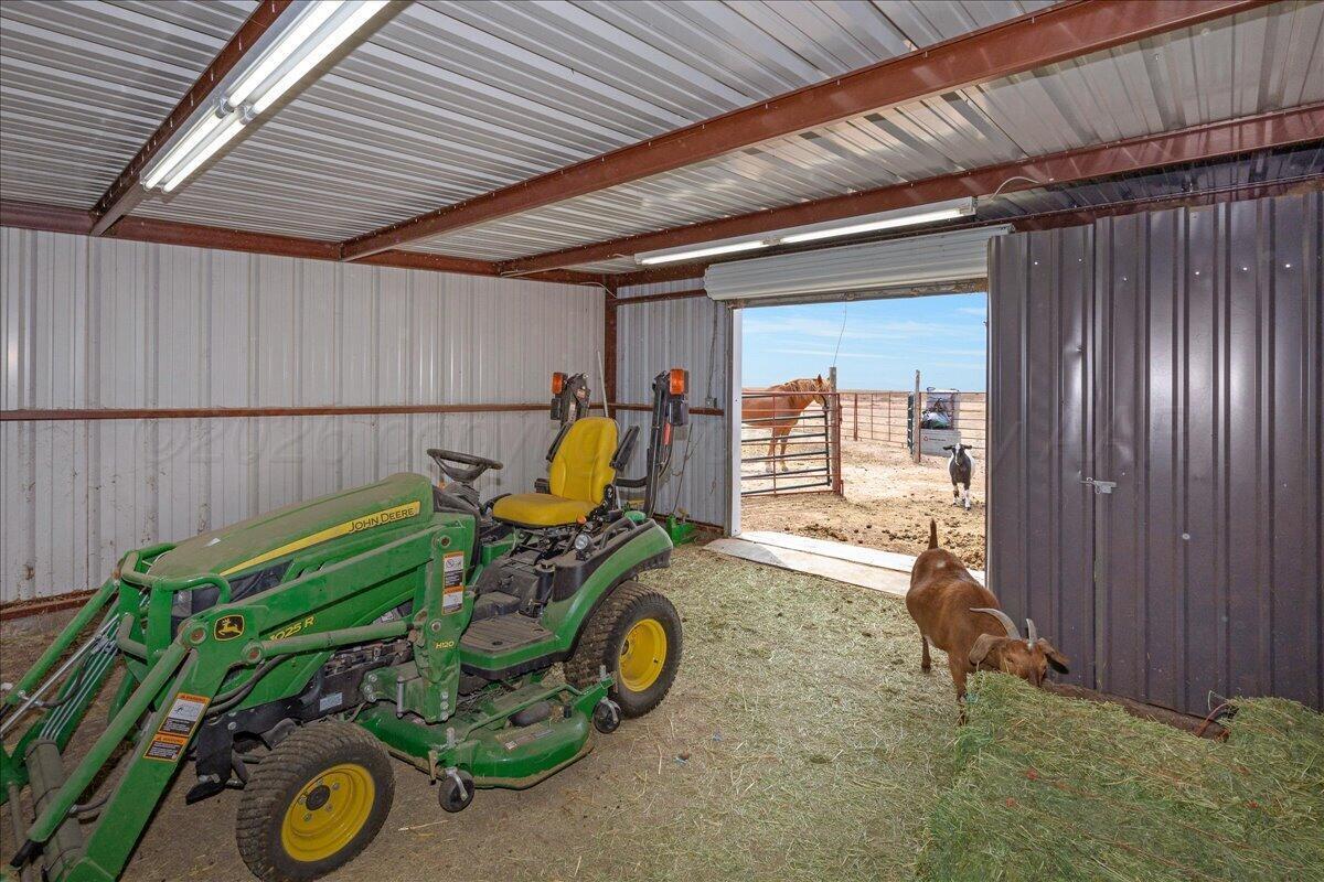 10551 Anderson Road Amarillo, TX 79118 - Photo 14 of 28 a view of a backyard with chairs and a grill