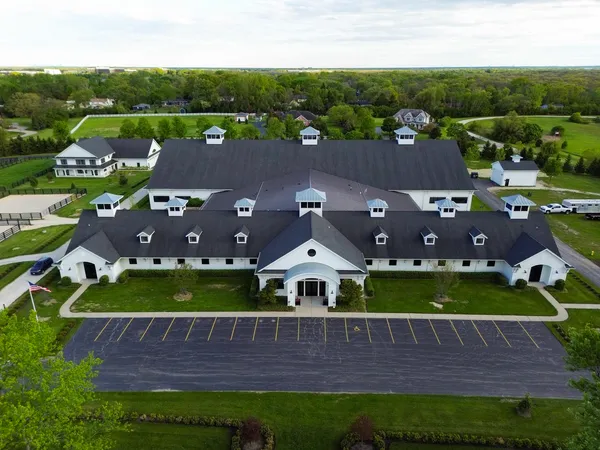 a aerial view of a house with a big yard