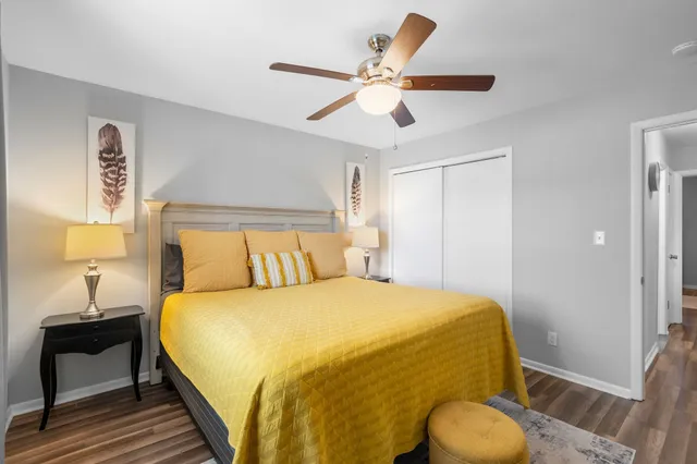 a bedroom with a bed and a chandelier