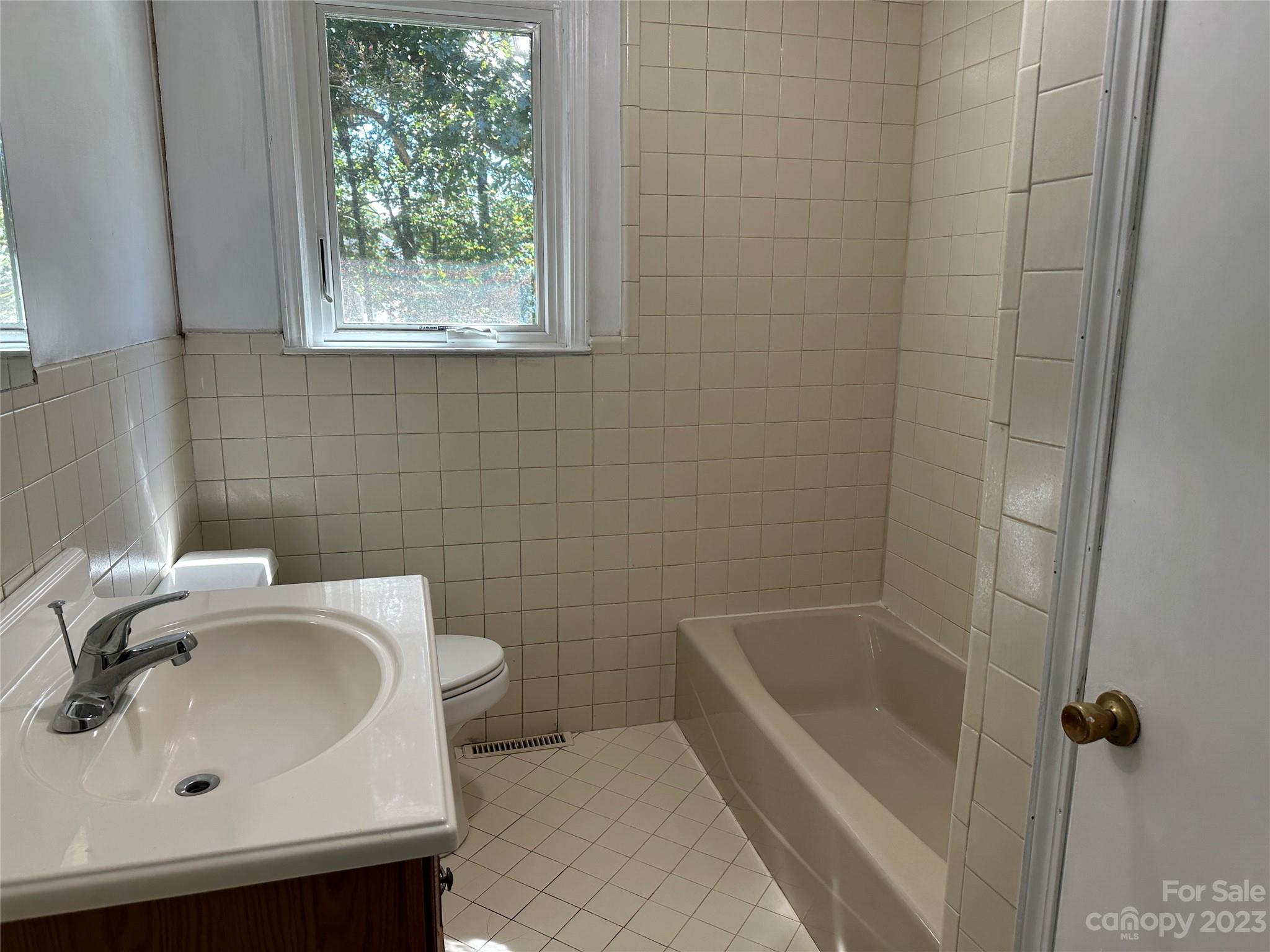 4205 Titman Road Gastonia, NC 28056 - Photo 10 of 16 a bathroom with a sink and a bathtub