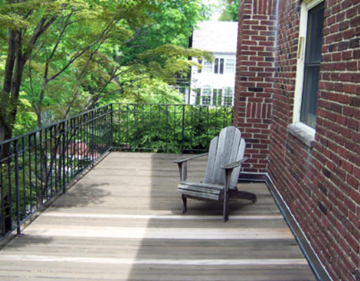 84 Salisbury Road Brookline, MA 02445 - Photo 14 of 16 a view of a chair and table in backyard of the house