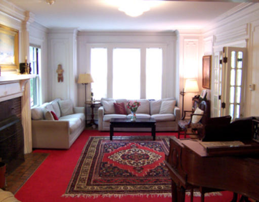84 Salisbury Road Brookline, MA 02445 - Photo 4 of 16 a living room with furniture fireplace and a large window