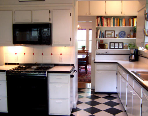 84 Salisbury Road Brookline, MA 02445 - Photo 8 of 16 a kitchen with stainless steel appliances a stove and a microwave