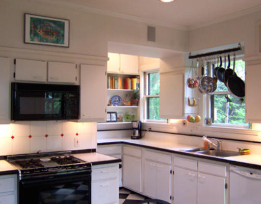 84 Salisbury Road Brookline, MA 02445 - Photo 9 of 16 a kitchen with a sink stove top oven and cabinets