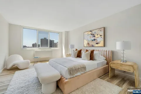 a bedroom with a bed and a couch