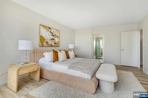 a bedroom with a bed and a lamp