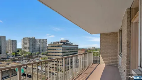 a view of a balcony with city view