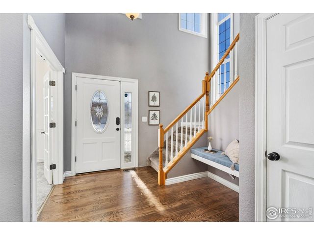 a view of entryway with wooden floor