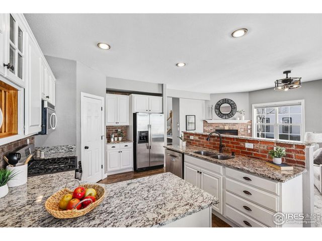 a kitchen with refrigerator and stove