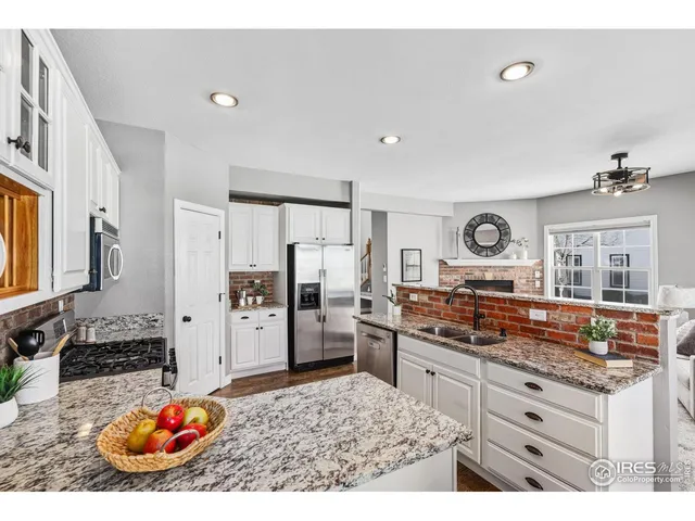 a kitchen with refrigerator and stove