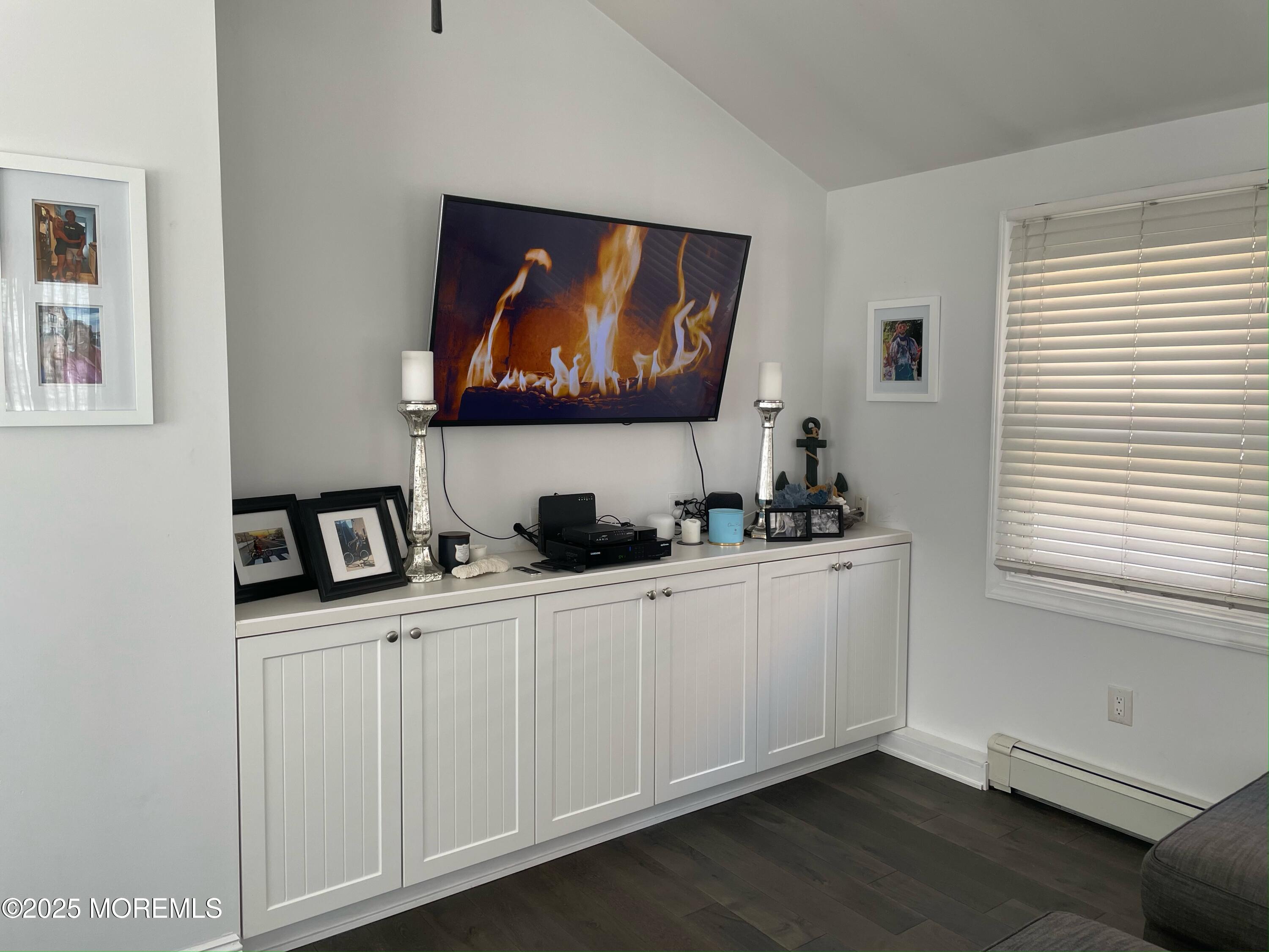 30 N Street Seaside Park, NJ 08752 - Photo 18 of 38 a room with furniture a flat screen tv and a window