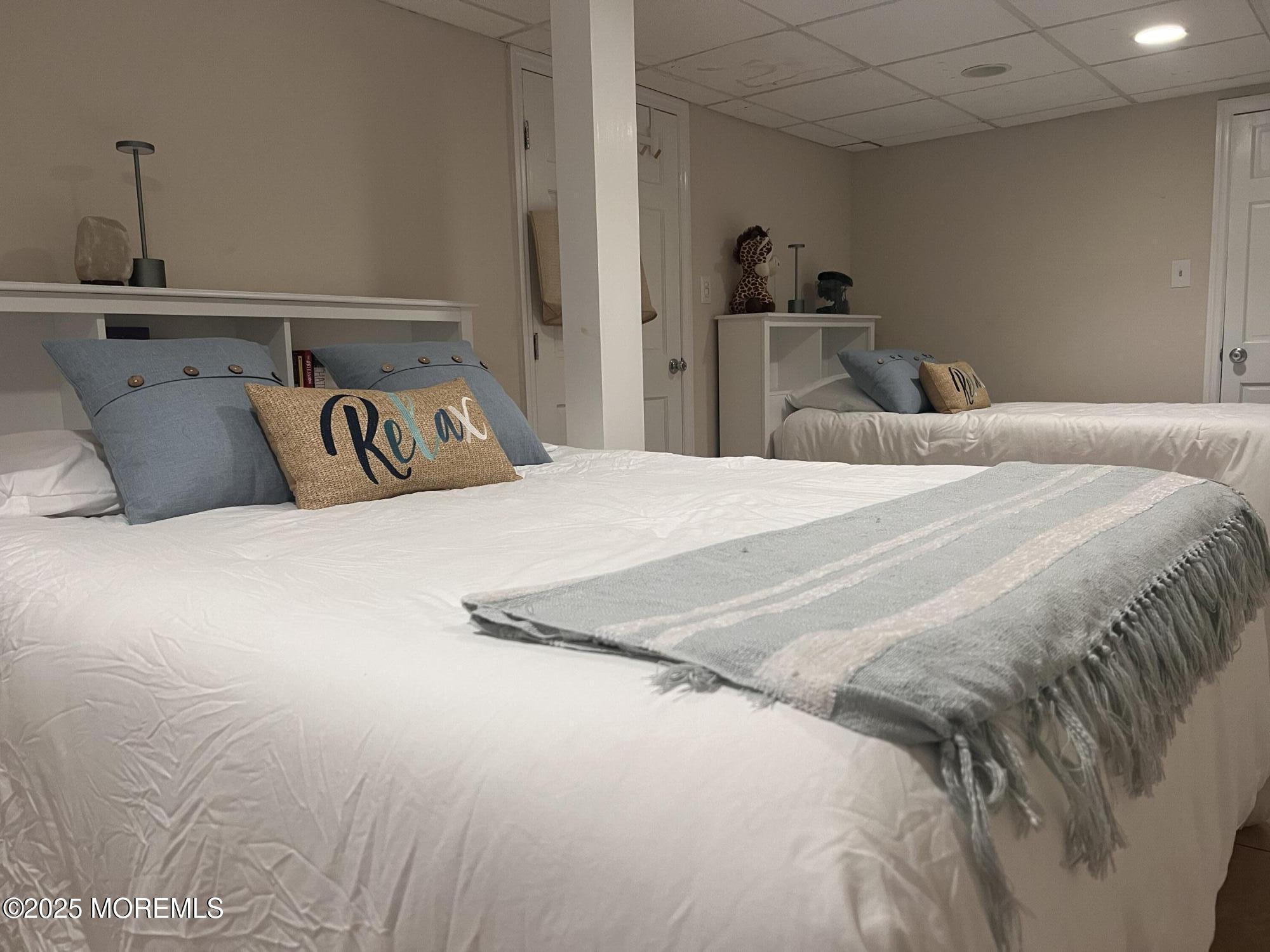 30 N Street Seaside Park, NJ 08752 - Photo 23 of 38 a bedroom with a bed and a walk in closet