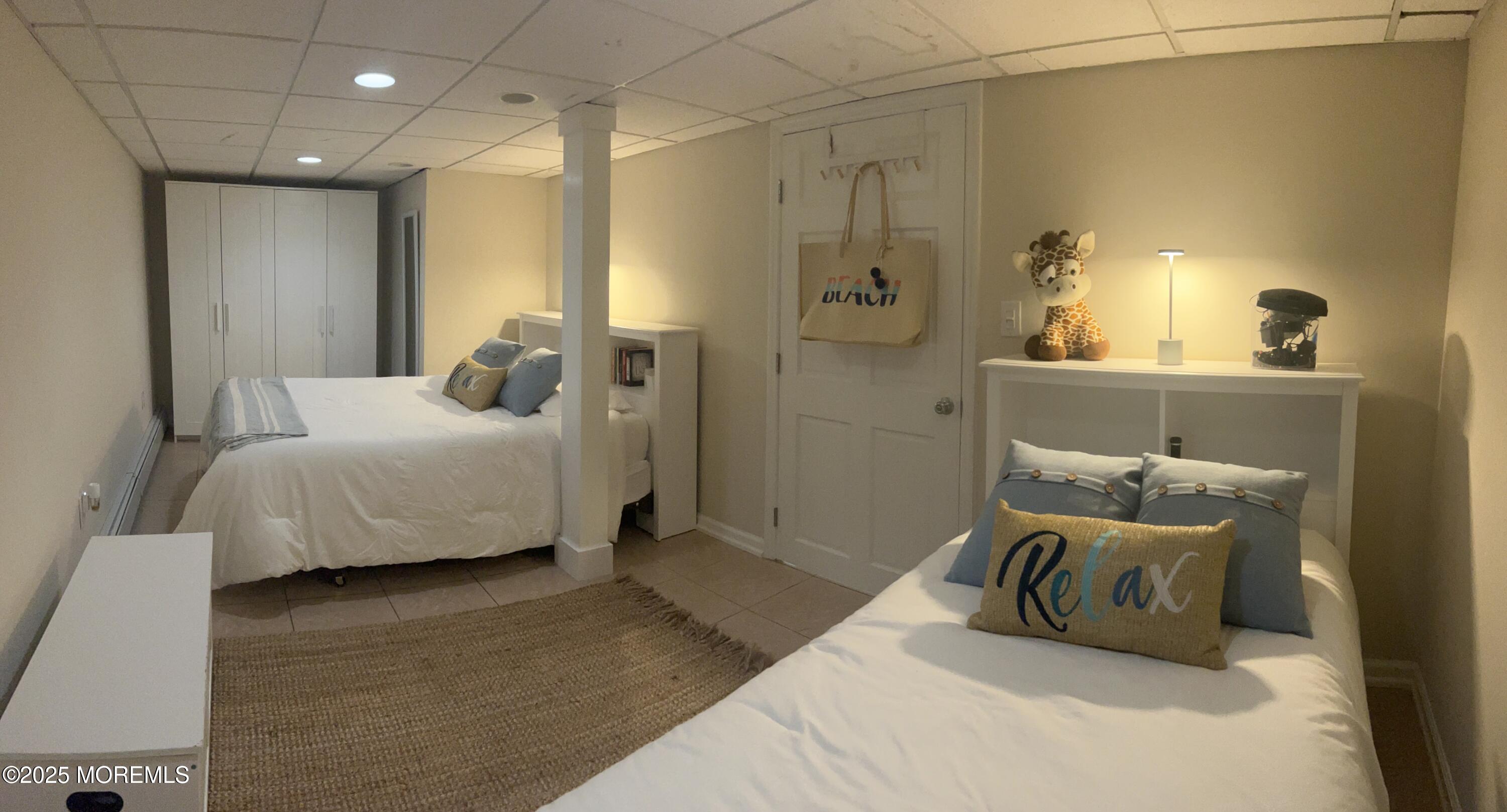 30 N Street Seaside Park, NJ 08752 - Photo 26 of 38 a bedroom with a bed and a couch