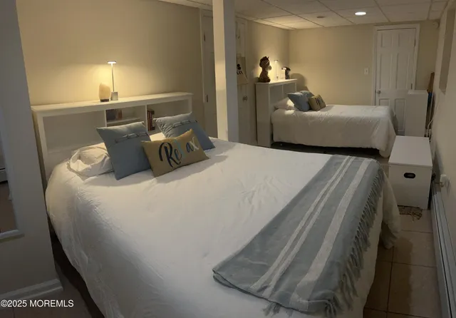 a bedroom with bed and window