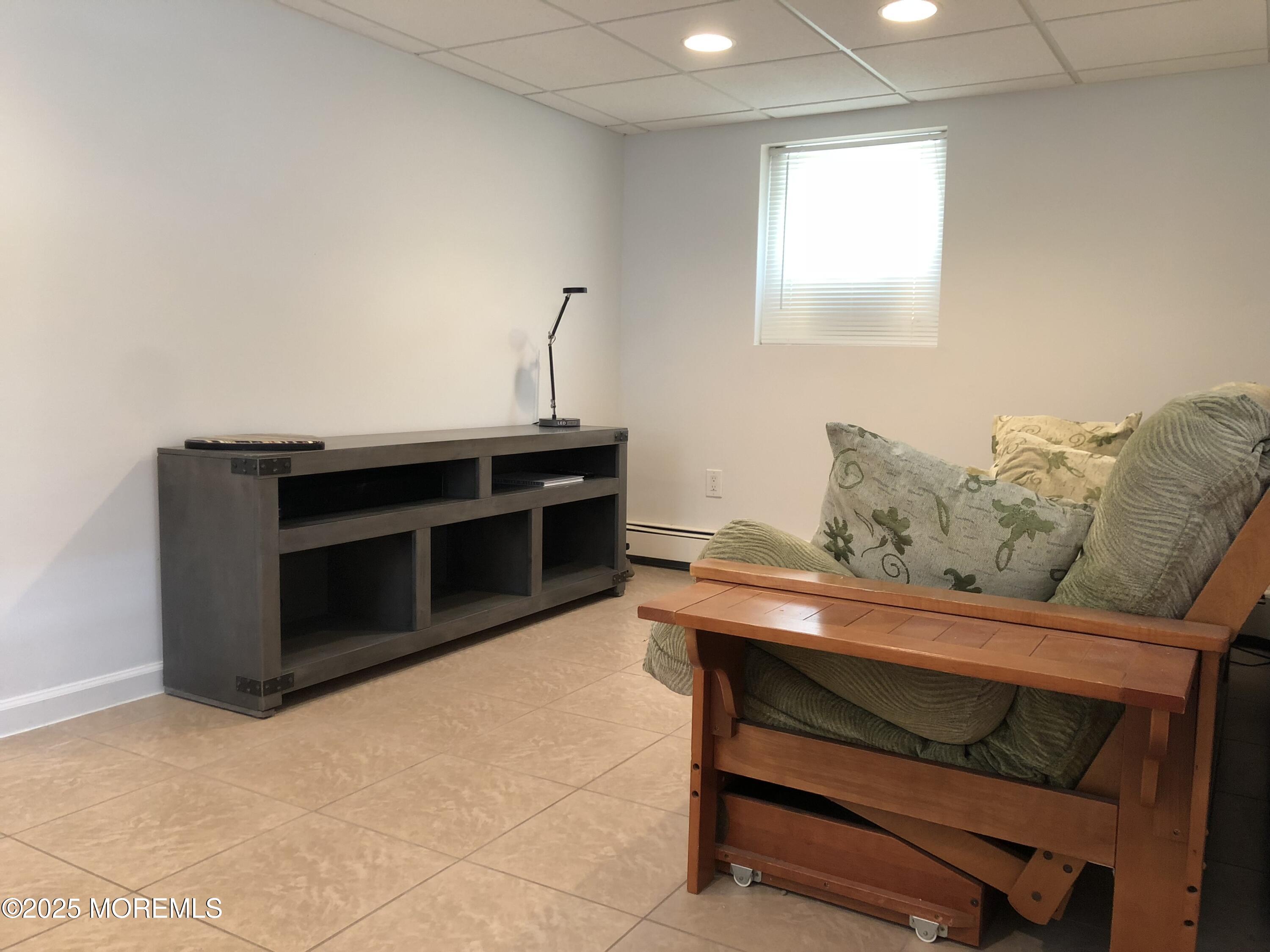 30 N Street Seaside Park, NJ 08752 - Photo 6 of 38 a living room with furniture and a fireplace