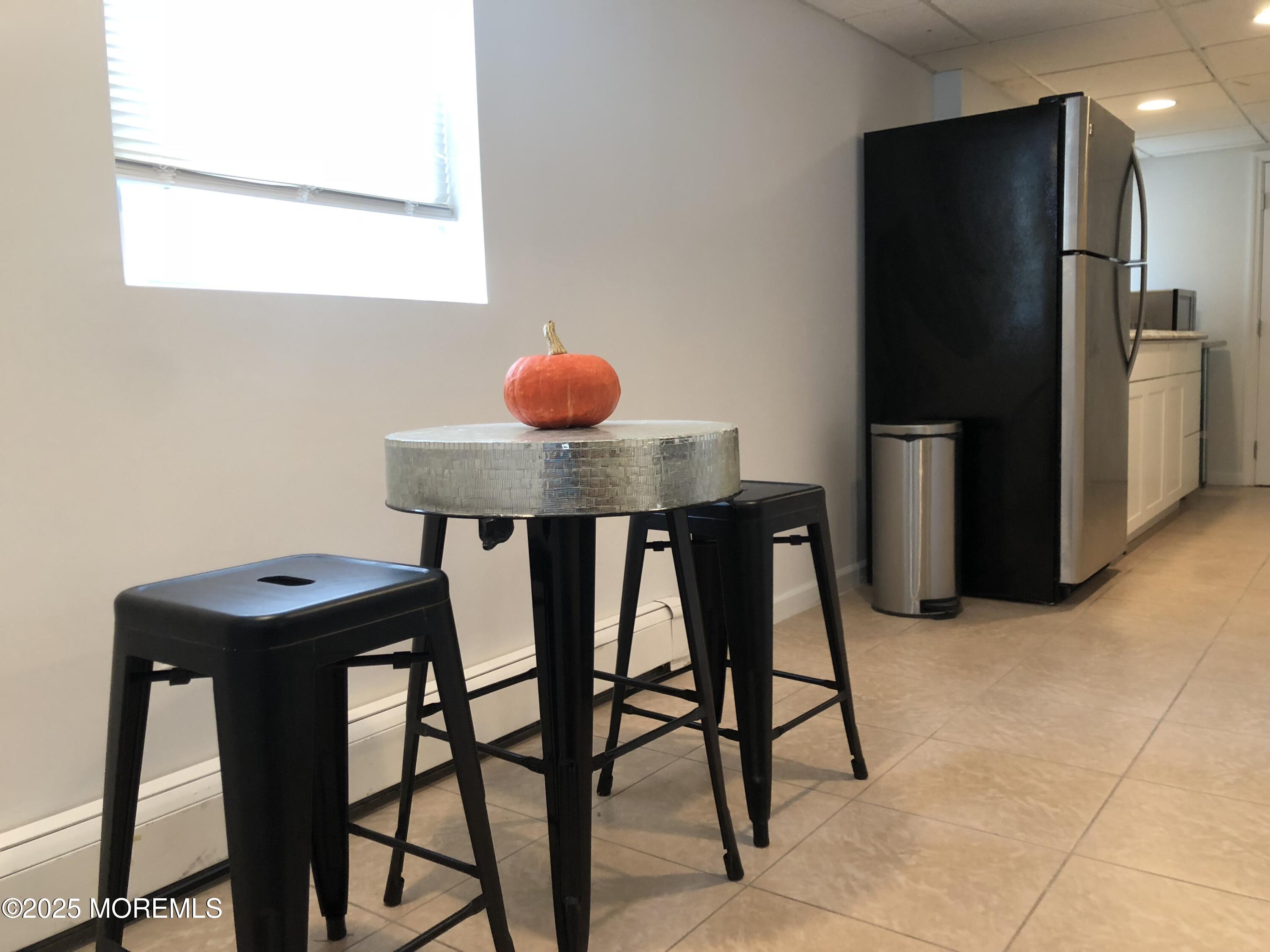 30 N Street Seaside Park, NJ 08752 - Photo 8 of 38 a view of a dining room with furniture and a chandelier