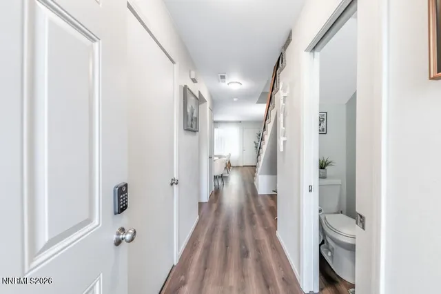 a bedroom with a bed and a chair