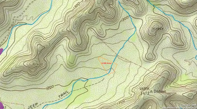 a bathroom with a window and a shower curtain