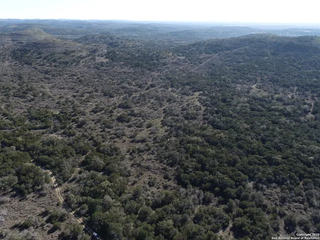 a view of a field with an outdoor space