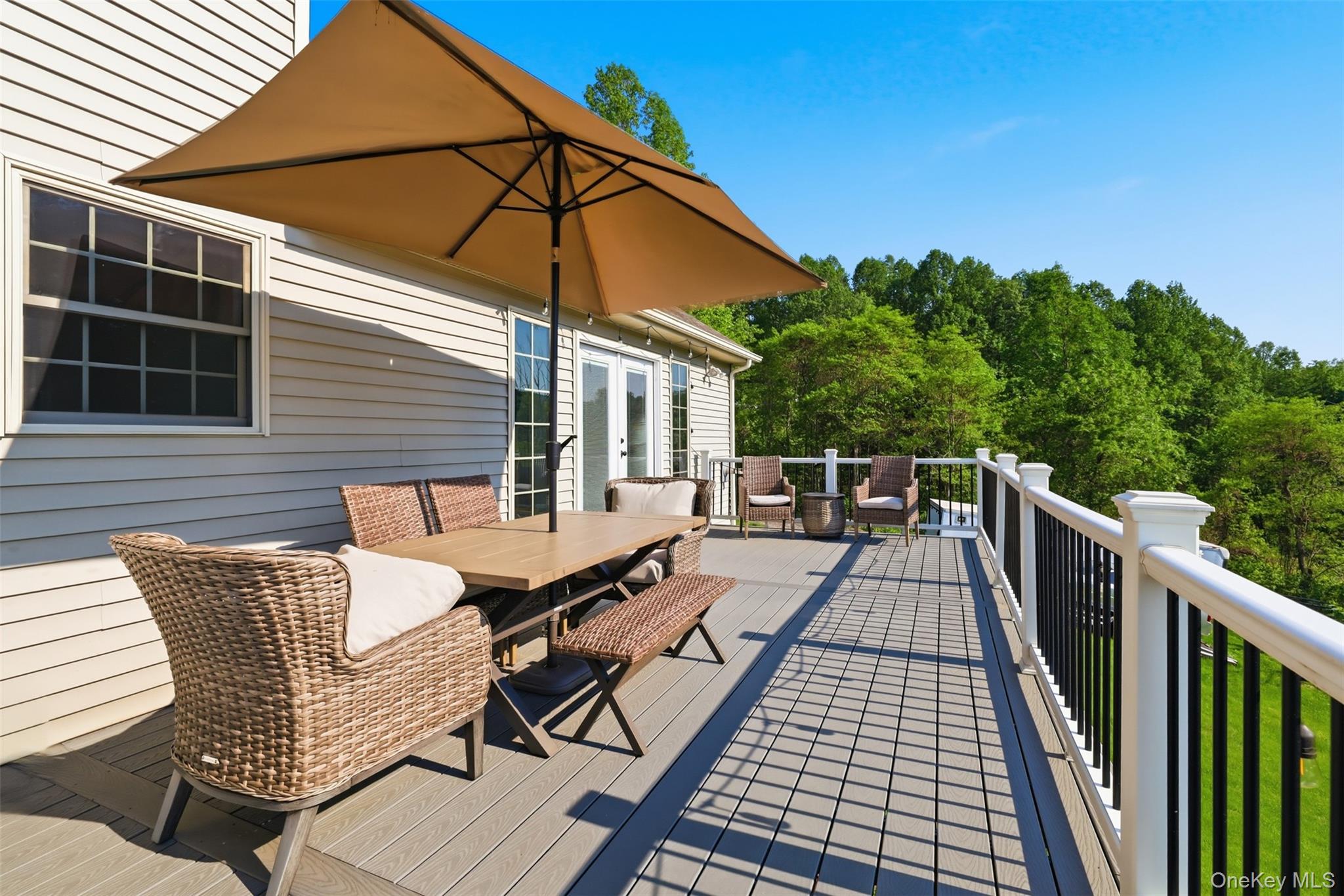 233 Devon Farms Road Stormville, NY 12582 - Photo 38 of 48 a view of a patio with wooden floor and iron fence