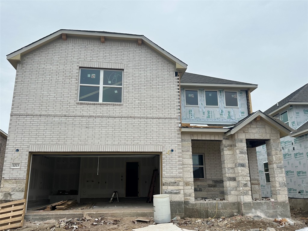 1013 Sienna Bear Road Georgetown, TX 78633 - Photo 1 of 1 a front view of a house with a yard