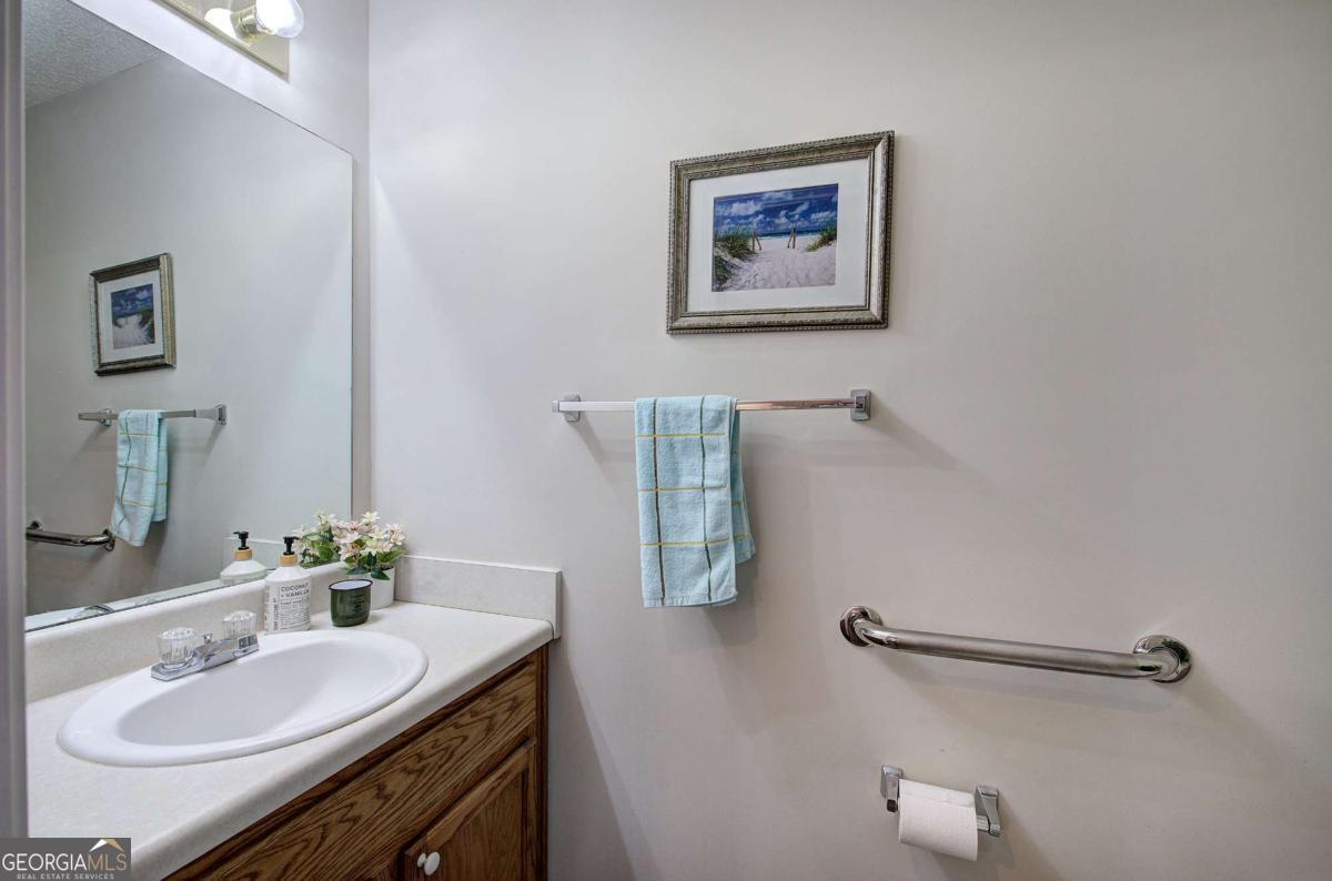 150 Old Mill Road, Unit 123 Cartersville, GA 30120 - Photo 18 of 27 a bathroom with a granite countertop sink and a mirror