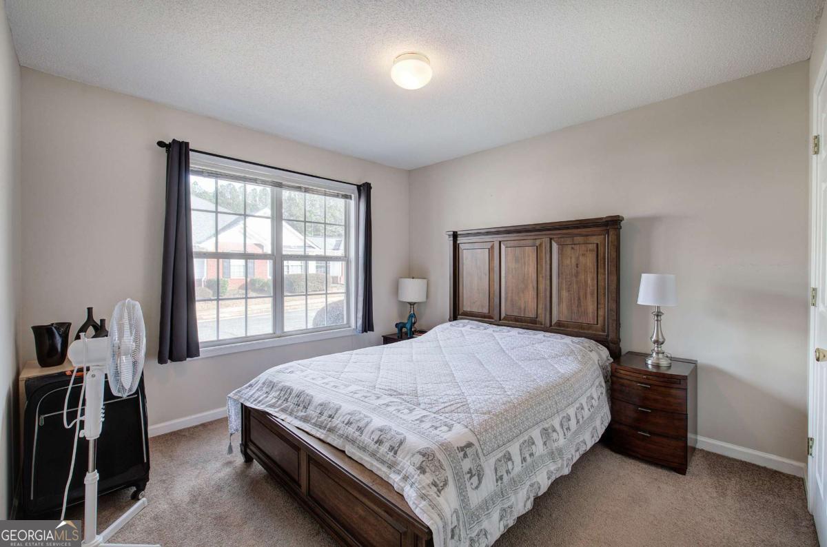 150 Old Mill Road, Unit 123 Cartersville, GA 30120 - Photo 19 of 27 a bedroom with a bed and a window