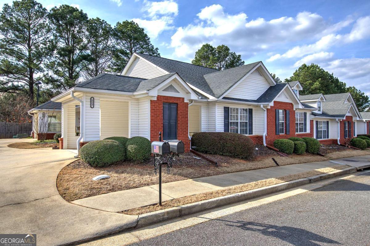 150 Old Mill Road, Unit 123 Cartersville, GA 30120 - Photo 2 of 27 a front view of a house with garden