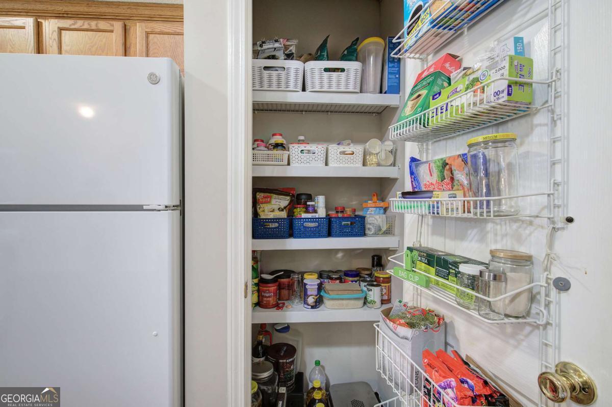 150 Old Mill Road, Unit 123 Cartersville, GA 30120 - Photo 21 of 27 a room with stainless steel appliances and a book shelf