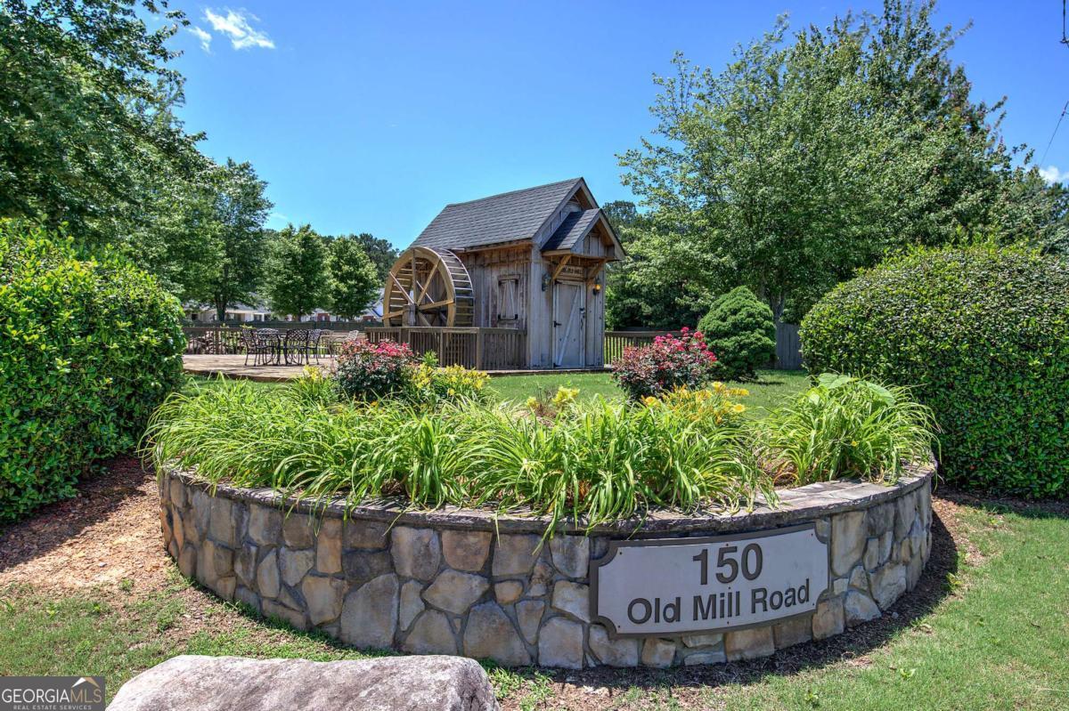150 Old Mill Road, Unit 123 Cartersville, GA 30120 - Photo 23 of 27 a wooden fence with some plants