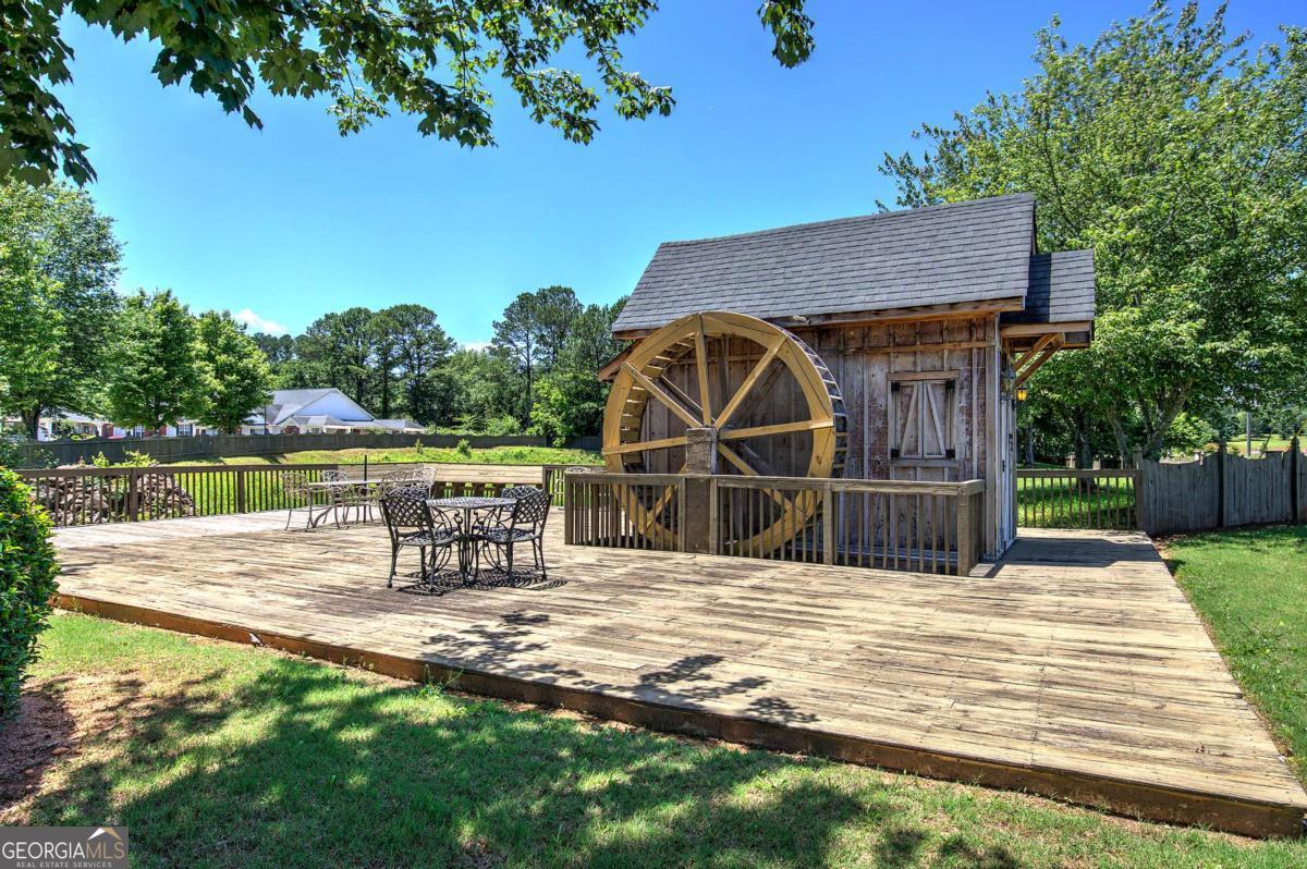 150 Old Mill Road, Unit 123 Cartersville, GA 30120 - Photo 24 of 27 a view of a house with yard and sitting area